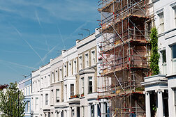 Traditional townhouses in Notting Hill, one of which is being renovated, London