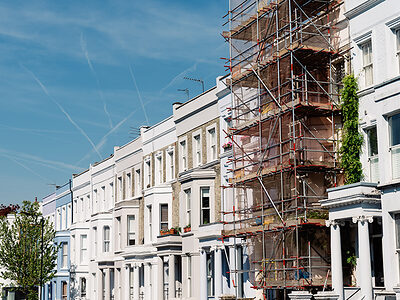 Traditional townhouses in Notting Hill, one of which is being renovated, London