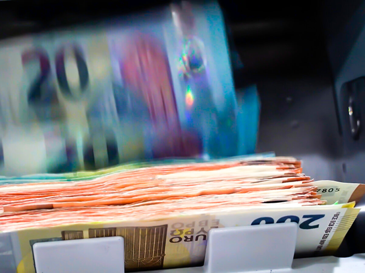 The Euro Currency Banknotes In A Currency Counting Machine.