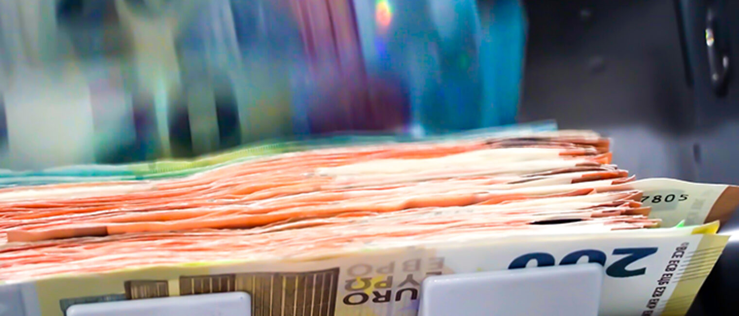 The Euro Currency Banknotes In A Currency Counting Machine.