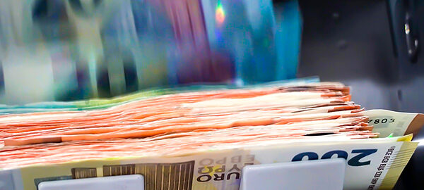 The Euro Currency Banknotes In A Currency Counting Machine.